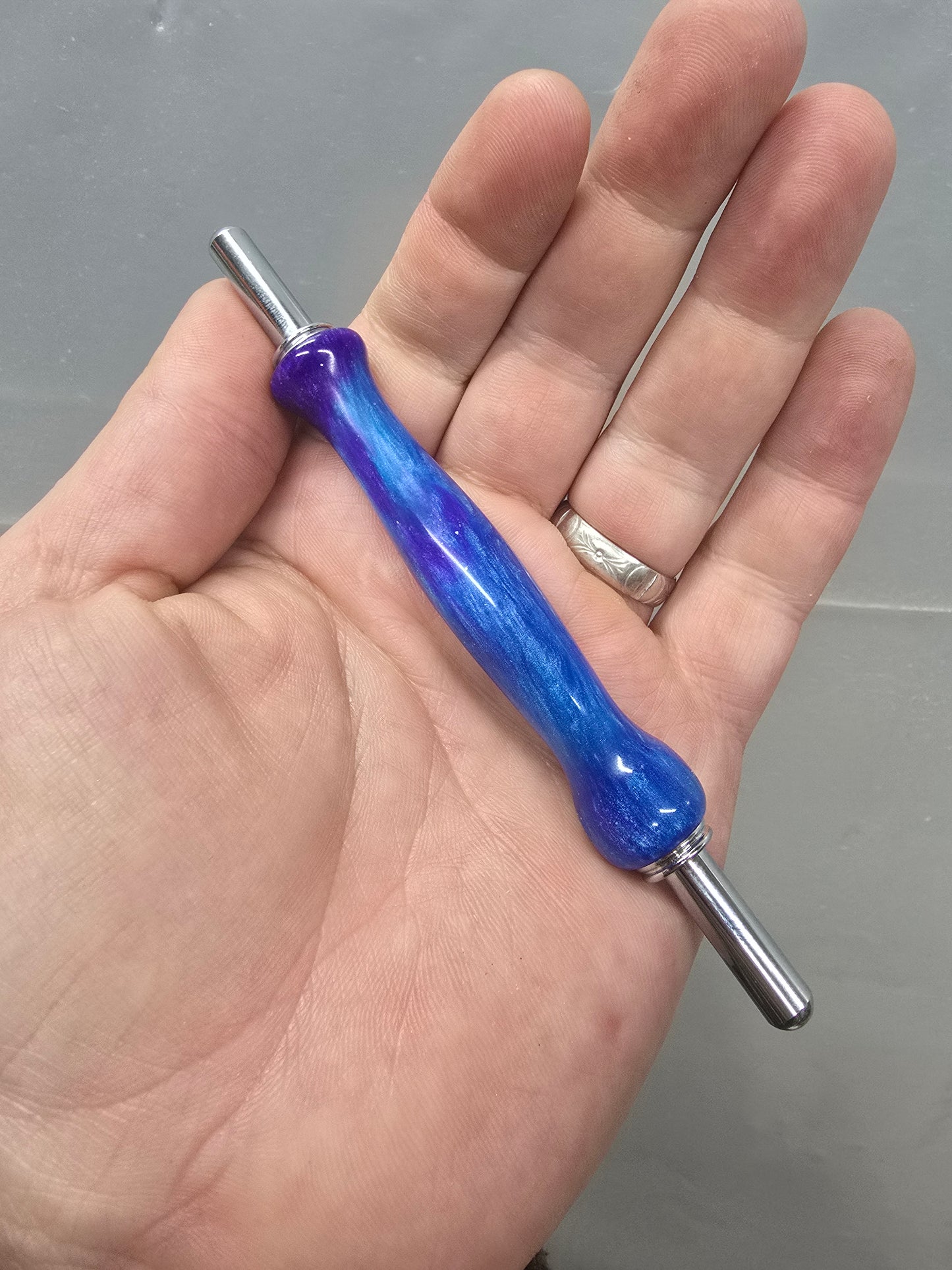 Blue and purple sewing seam ripper and stiletto combo tool